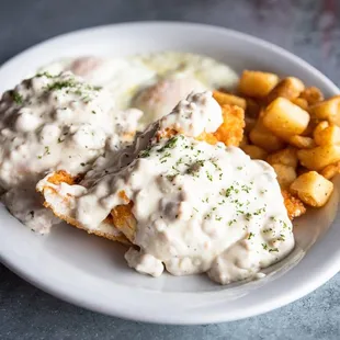 Country Biscuits and Gravy with fried chicken and breakfast potatoes!!