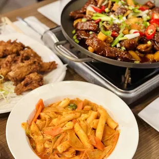 Rosé Rice Cake, Spicy Braised Short Rib, Fried Chicken Wings