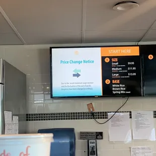 a price change notice on the wall