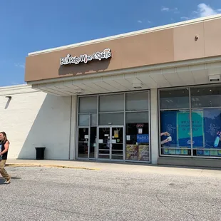 a man walking in front of a store