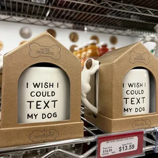 two coffee mugs on a shelf