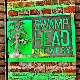 a sign for swamp head brewery