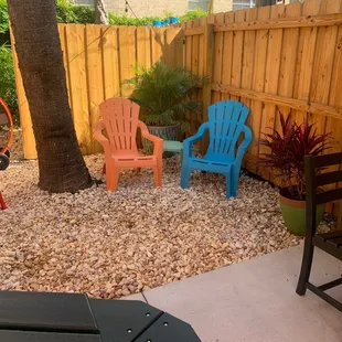 a patio with chairs and a table