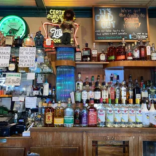 a bar with a variety of liquors