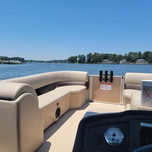 View of front pontoon boat from the captains chair.