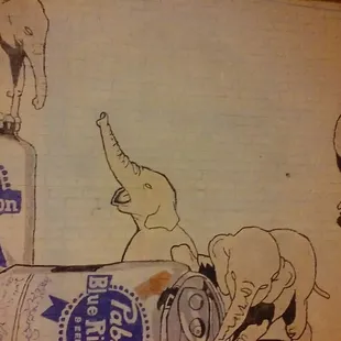 an elephant and a can of beer
