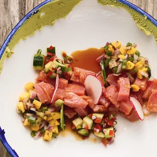 Sashimi tuna comes with garlic, chilis, yuzu citrus, wasabi and sweet soy sauce