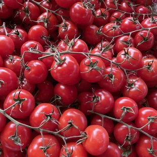 Swank uses a green house and has beautiful tomatoes before the main season