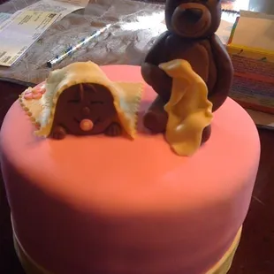 the cake topper for the stand with coordinating cupcakes