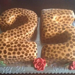 My godsister's birthday cake -- animal print fondant with red roses (I think red velvet or chocolate)