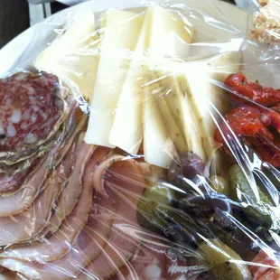 Luncheon Plate ($15) to go: 3 cheeses, 3 meats, olives, sun dried tomatoes, pickles and crackers.  Serving for 2.