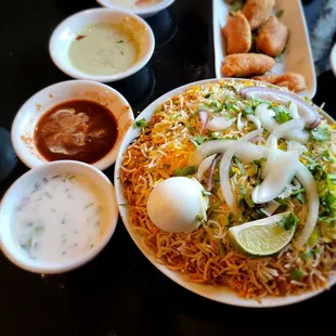 Goat Biryani (Raita (yogurt- cucumber based sauce to combat spicyness or just enjoy w/ samosasz salad or rice.