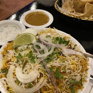 Goat Biryani side of gravy and raita