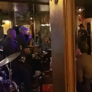 a group of people sitting at a bar