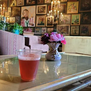 A champagne cocktail (to go) from Bayou Bar enjoyed in the Jack Rose Lounge