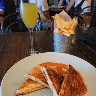 Wild mushroom grilled cheese, garlic fries, kiwi mimosa