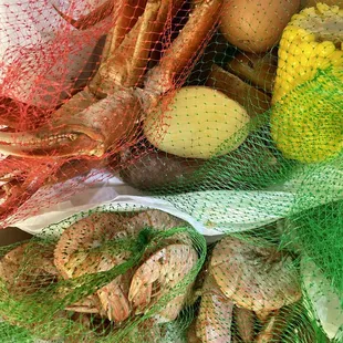 King crab and red shrimp with potatoes, sausage and corn