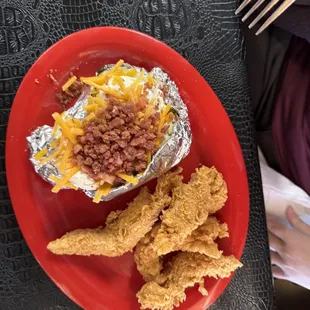 Chicken tender platter with loaded baked potato