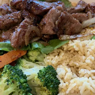 Shaking beef with veggie medley and fried rice closeup