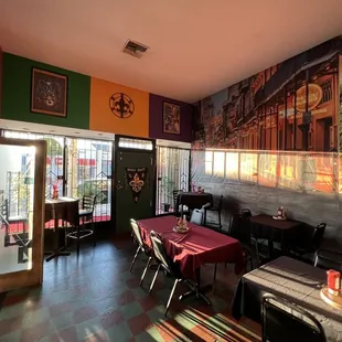 a dining room with tables and chairs