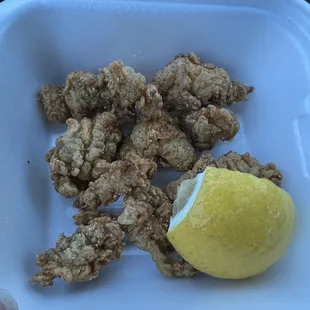 a lemon in a styrofoam container