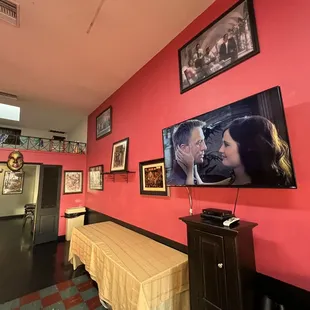 a dining room with a flat screen tv