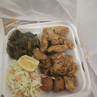 Fried oysters and catfish with greens and cold slaw.