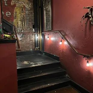 a staircase leading to a bar