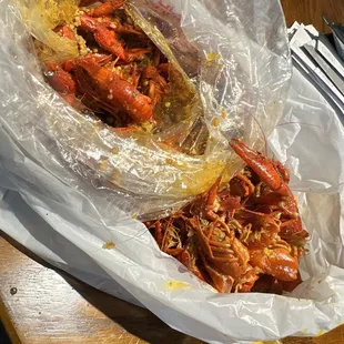 a lobster wrapped in plastic