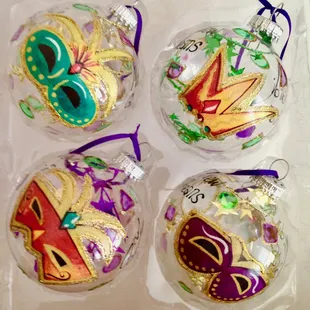 Assorted Mardi Gras ornaments.Made in America, hand painted in New Orleans. A Bayou Threads Gifts exclusive.