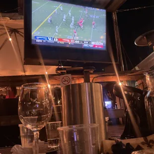 a flat screen television on a bar