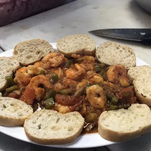 a plate of shrimp and vegetable stew