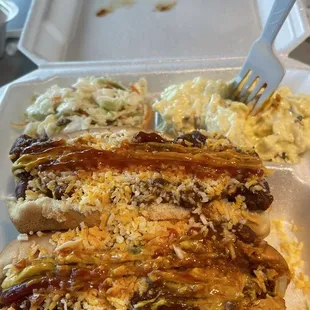 Chili dog meal special with potato salad and coleslaw.
