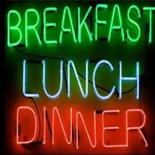 a neon sign that reads breakfast lunch dinner