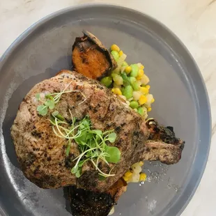 Prime pork chop with succotash and sweet potato