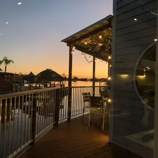 Sunset out the back window and outside seating.