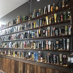 a wall full of beer taps