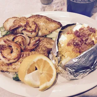 Grilled flounder, veggies (under the fish), baked potato. Tasted great!  Wasn&apos;t overlooked, potato was perfect &amp; veggies crisp.