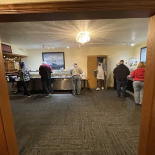 a group of people preparing food