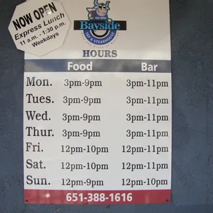 Hours of operation, front entry door.  They also specify food times - nice touch!