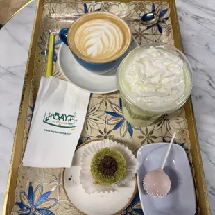 Latte, pistachio frappe, basbusa and cake pop