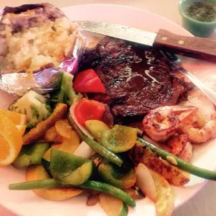 T-bone Steak: grilled shrimp: grilled veggies: and a baked potato with everything