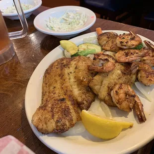 Grilled flounder with grilled shrimp. Side of slaw and French Fries. My husband finished the plate. He was so stuffed and satisfied.