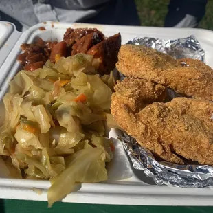 Fried salmon with sautéed cabbage and yams.