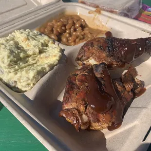 Chicken dinner plate. Two piece smoked chicken, great potato salad and beans. Came with regular sliced bread.