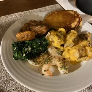 Shrimp, fiesta potatoes, steamed greens, candy yams, buttermilk hoe cake