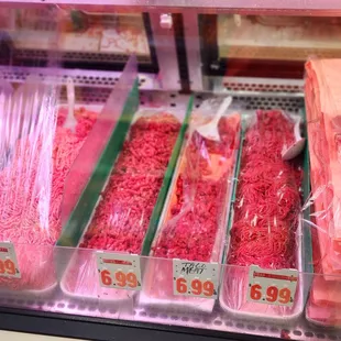 a display of meat and fish