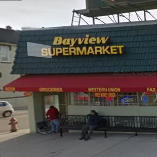 two people sitting on a bench