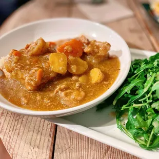 Curry &amp; Biscuit $13.50 Makiko's Japanese Curry with a hint of South Africa &amp;Ghost Pepper served on a biscuit w/ an arugula salad + Chicken.