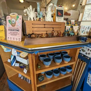 Delightful dino figurines from clay &amp; groovy Bazaar Cafe mugs. The tiny dinos are 20 bucks a pop, btw.